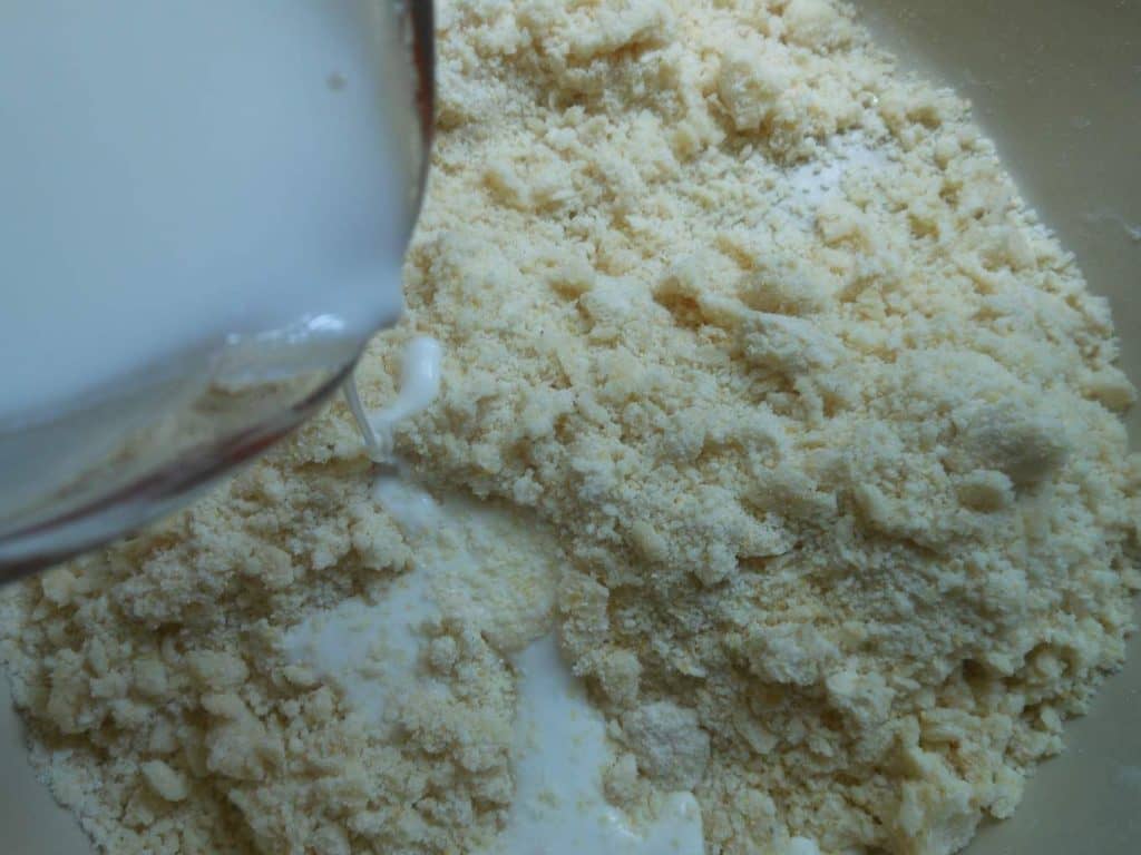 sour cream and ice water poured over coarse crumbs
