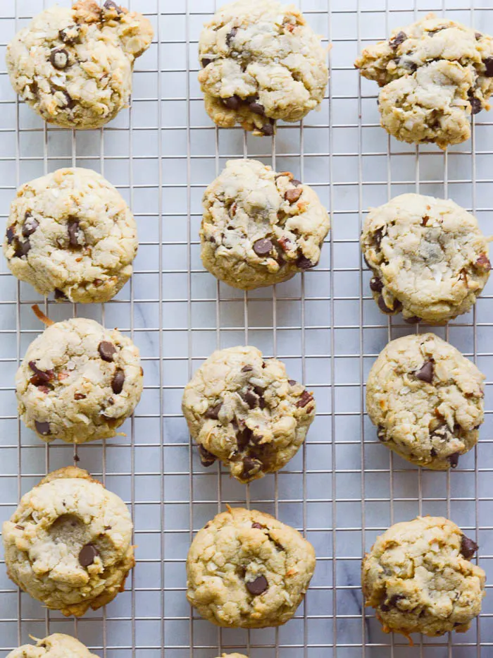 Thick chocolate chip pecan cookies cooling on a wire rack