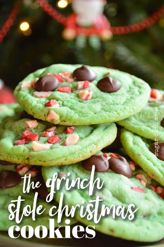 The Grinch Stole Christmas Cookies are soft, chewy, and minty green. Studded with Andes Peppermint Crunch Chips and dark chocolate, piled up on a plate under the tree, ready for Santa!