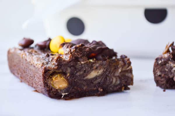 A Reese's Cheesecake Brownie made with Reese's Pieces