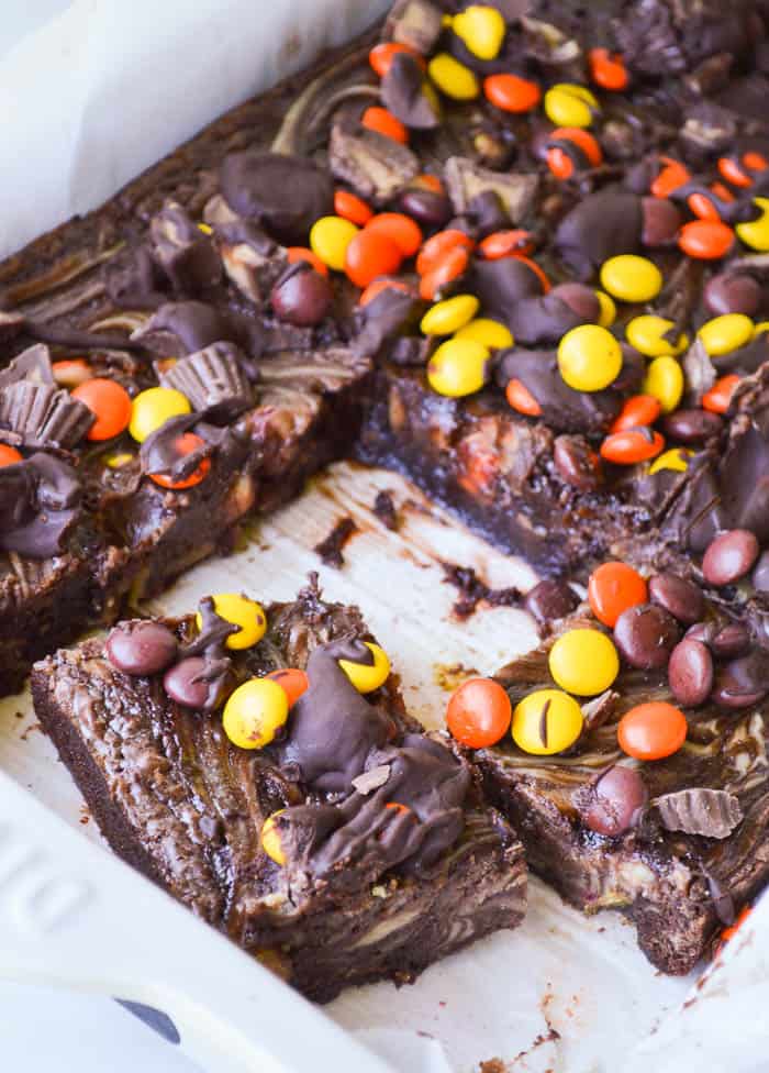 Fudgy brownies with a swirl of peanut butter cheesecake topped with Reese's peanut Butter Cups and Reese's Pieces