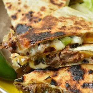 Philly Cheese Steak Quesadillas with the most tender beef made in the slow cooker