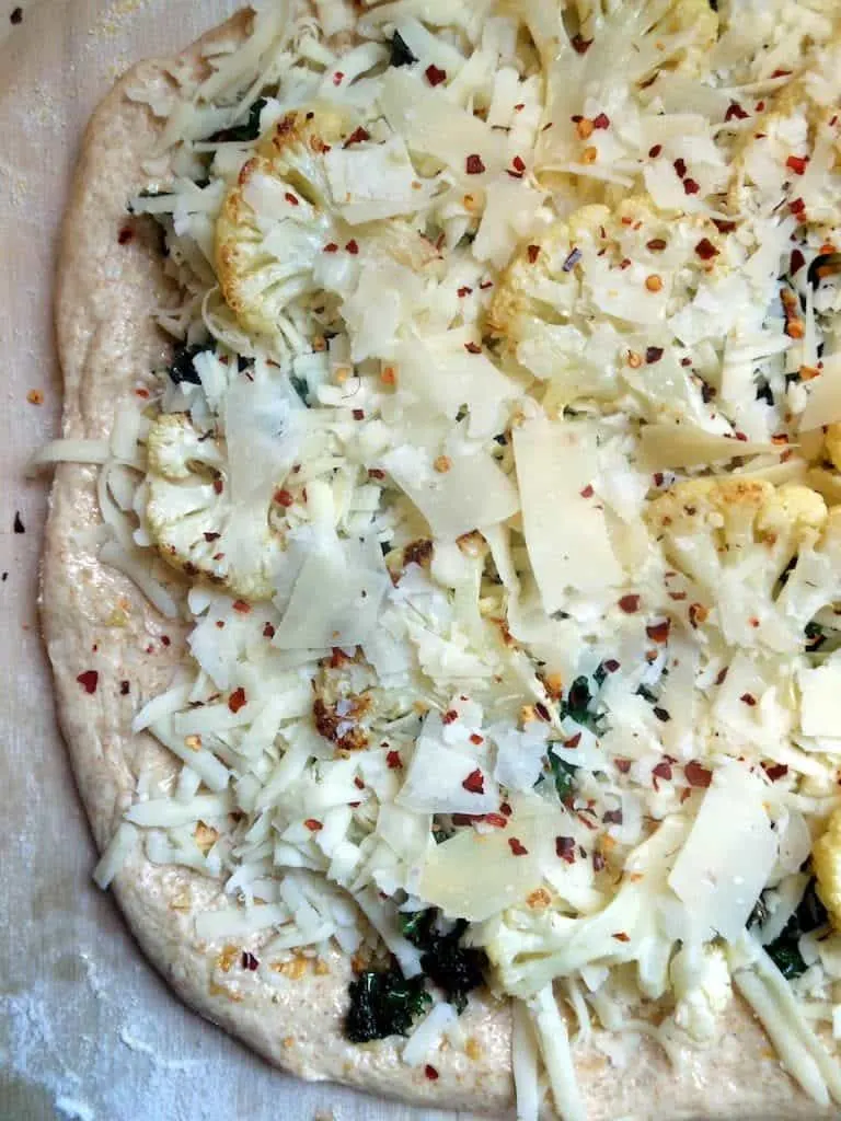homemade white pizza with cauliflower & kale