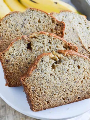 Biscoff Banana Bread sliced on a cake stand ready for enjoying