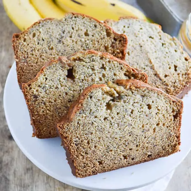 Biscoff Banana Bread sliced on a cake stand ready for enjoying