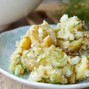 Dill Potato Salad on a pretty plate; close up shot with lots of fresh dill