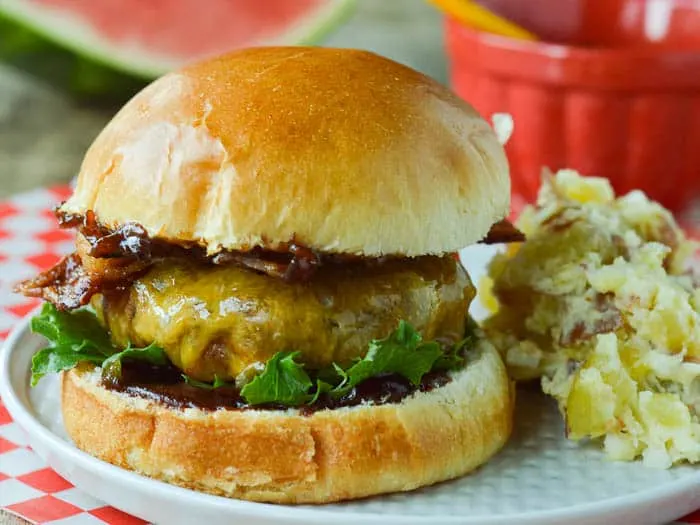 4 X 3 close up of BBQ Bacon Burger on a plate with potato salad