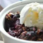 Slow Cooker Blueberry Coconut Cobbler warmed with ice cream on top