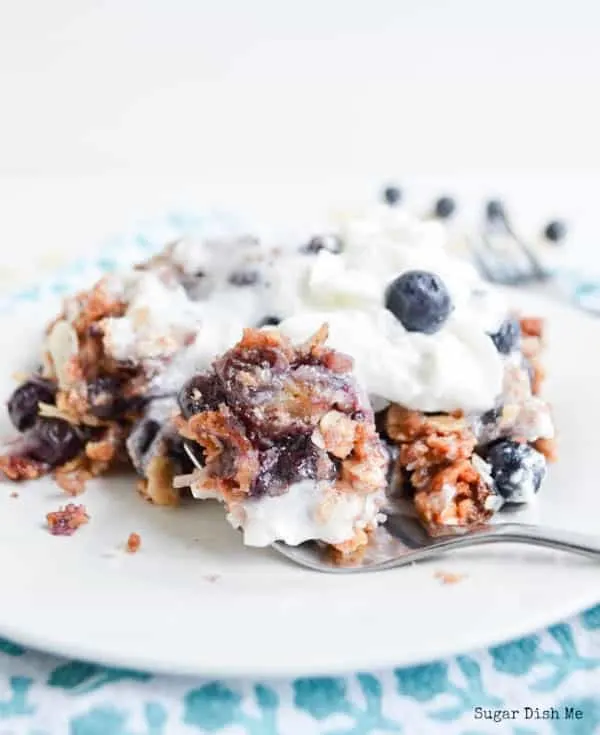 Simple Slow Cooker Blueberry Cobbler with fresh blueberries and whipped cream