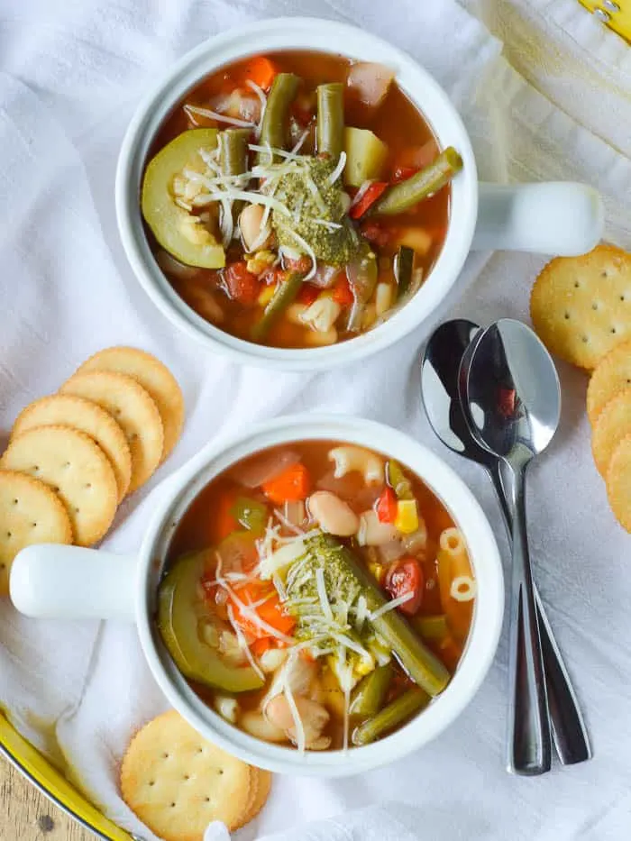 Two white crocks of Summer Vegetable Soup 