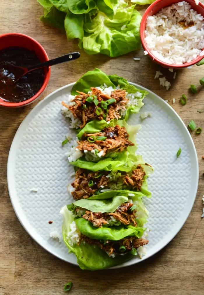Chinese Pork Lettuce Wraps made with buttery lettuce leaves, jasmine rice, and shredded Chinese Hacked Pork. 