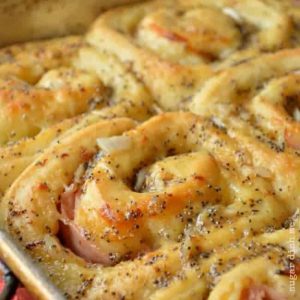 Croque Monsieur Rolls are thick brioche rolled up and baked with ham, cheese, mustard, and plenty of butter