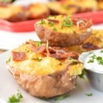 Twice Baked Breakfast Potatoes topped with bacon and parsley