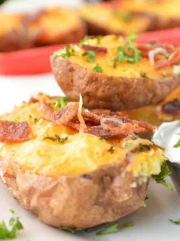 Twice Baked Breakfast Potatoes topped with bacon and parsley