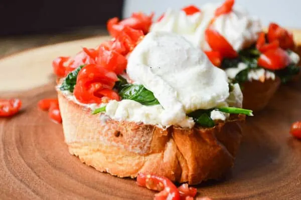 Whipped Feta Breakfast Crostini with a poached egg