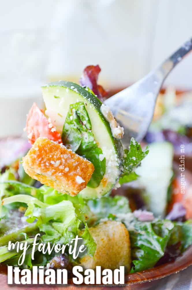 A forkful of bright mixed greens, cherry tomatoes, croutons, and cucumbers coated with tangy homemade Italian dressing and Parmesan cheese makes this my Favorite Italian salad