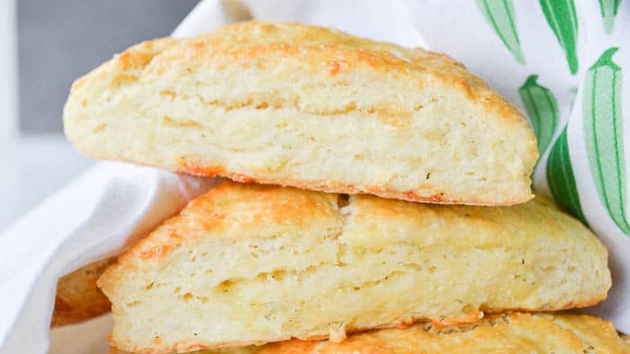 Garlic Herb Cheddar Scones wrapped in a tea towel to stay warm