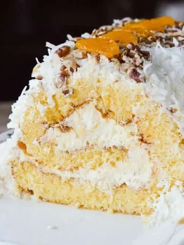This cake roll recipe is filled with pineapple fluff and covered in coconut