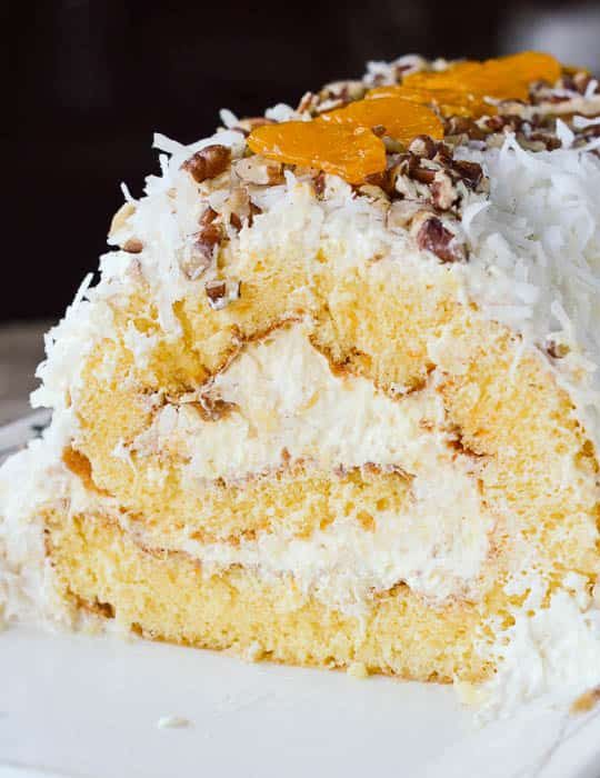 This cake roll recipe is filled with pineapple fluff and covered in coconut