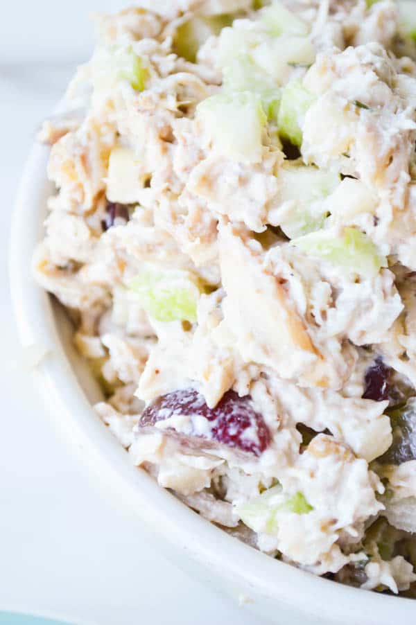 Bowl of Rotisserie Chicken Salad loaded with celery, grapes, apples, and a delicious creamy dressing