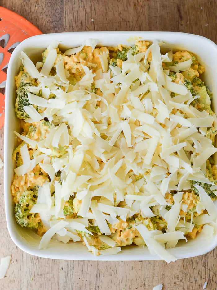 broccoli casserole topped with shredded cheddar and ready to bake. This classic recipe is easy to make ahead in just a few minutes. 