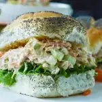 Permalink to: Buffalo Chicken Salad Sandwich Buffalo Chicken Salad piled onto a fluffy poppy seed roll with leafy lettuce.