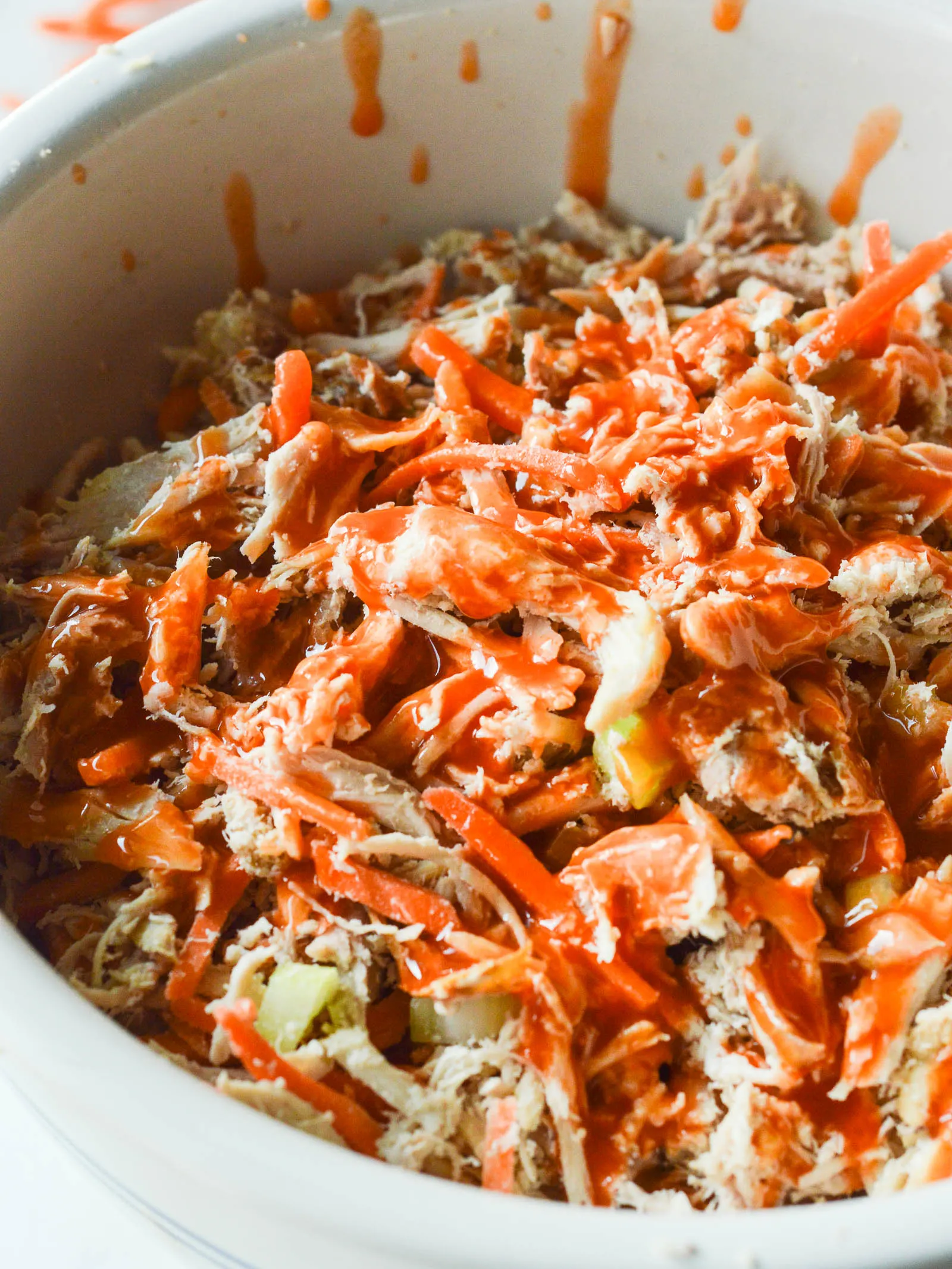 Shredded chicken, matchstick carrots, and chopped celery are doused with hot sauce to add a little extra heat to Buffalo Chicken Salad Sandwiches