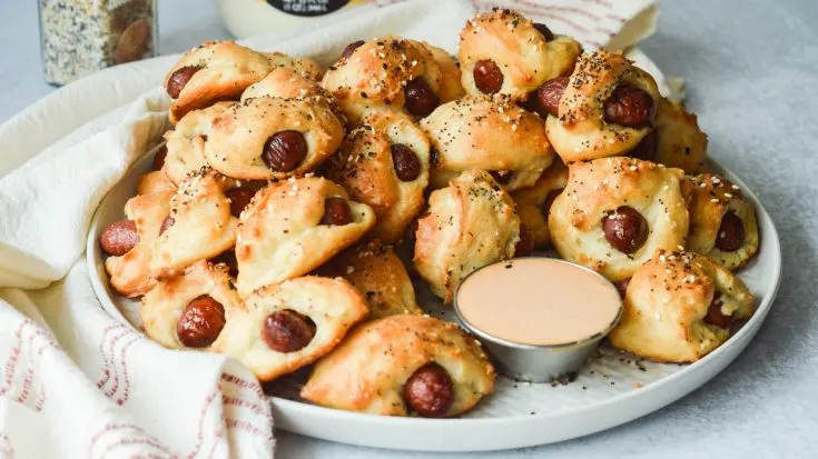 Pigs in a Blanket made with homemade 3-ingredient biscuits, plated with Comeback dipping sauce