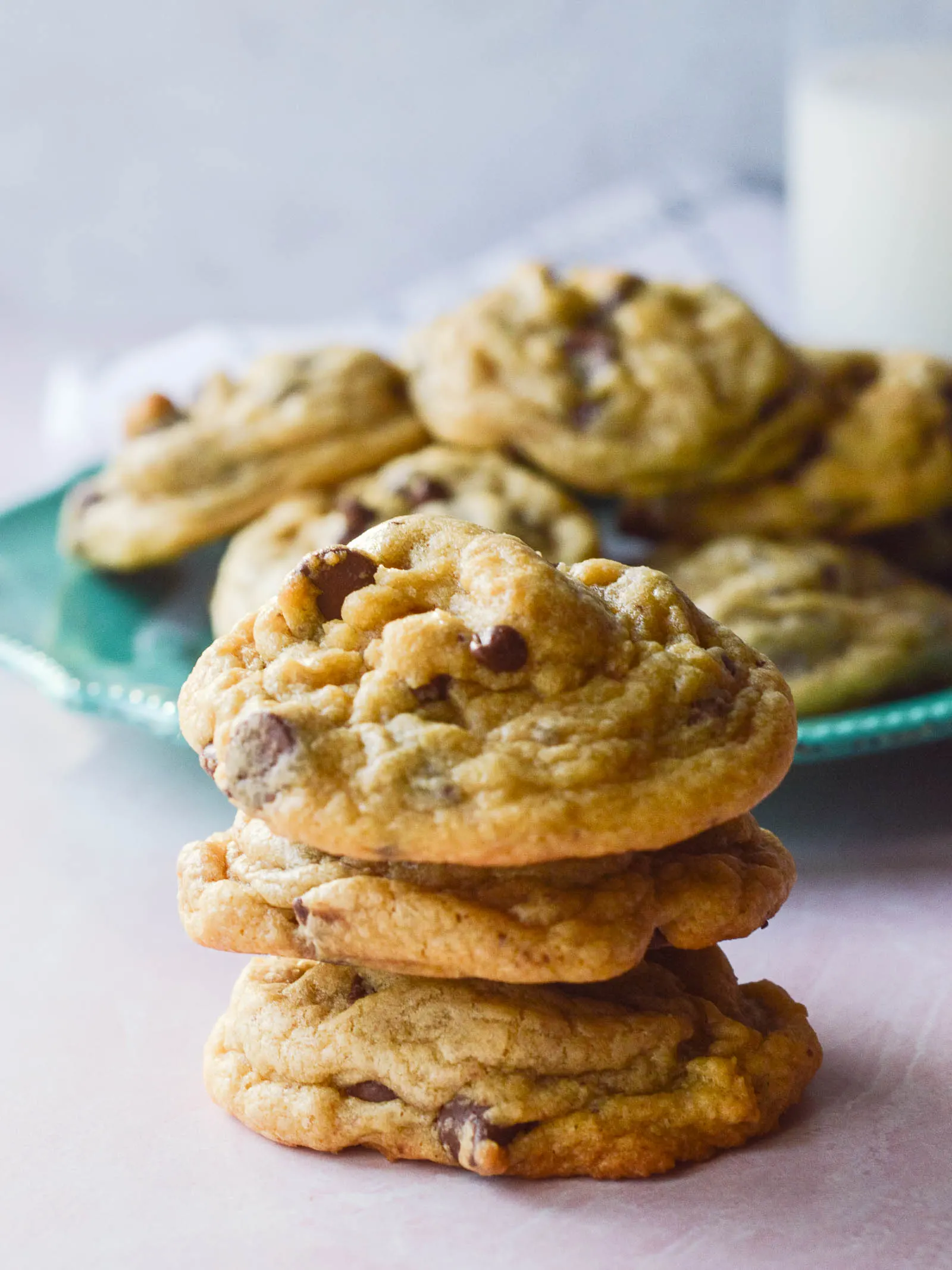 A stack of soft and perfectly wrinkly chocolate chip cookies made with pudding in the mix