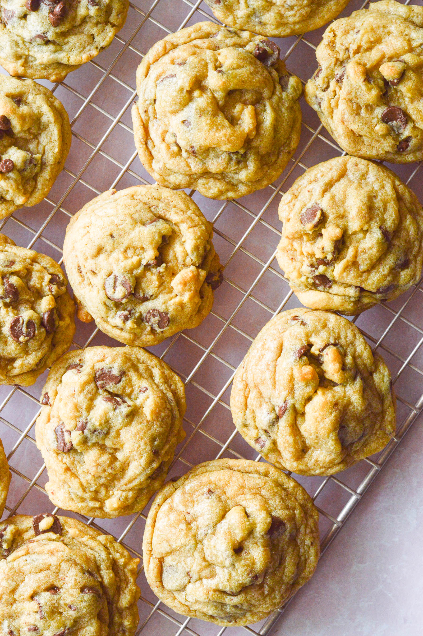 Overhead image of soft Chocolate Chip Pudding Cookies cooling on a wire rack